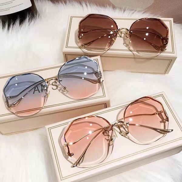 New fashion frameless trimmed sunglasses for women with deformed metal curved temples, internet celebrity street shot sun protection sunglasses