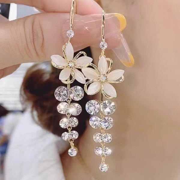 New cat's eye stone five-petal flower super fairy ear hook female Korean temperament fashion high-end crystal tassel internet celebrity earrings